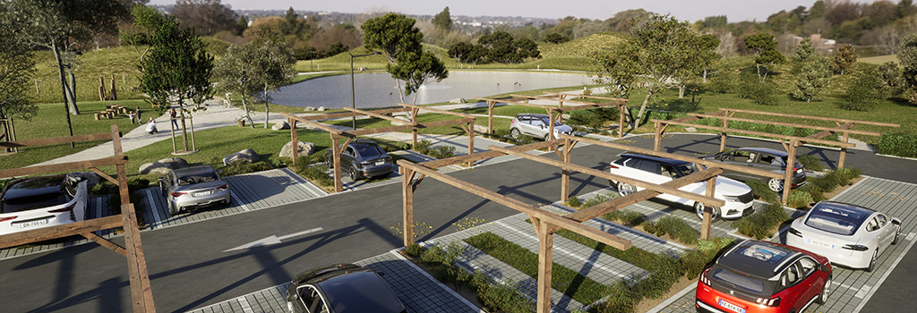Vue aérienne d'un parking paysager perméable avec pergolas bois et dalles drainantes, intégré dans un site naturel classé — solution Nidaplast