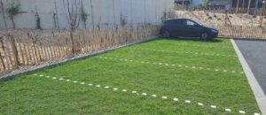 Parking perméable gazon sur dalles Nidagrass — conformité loi Climat et Résilience CBS PLU